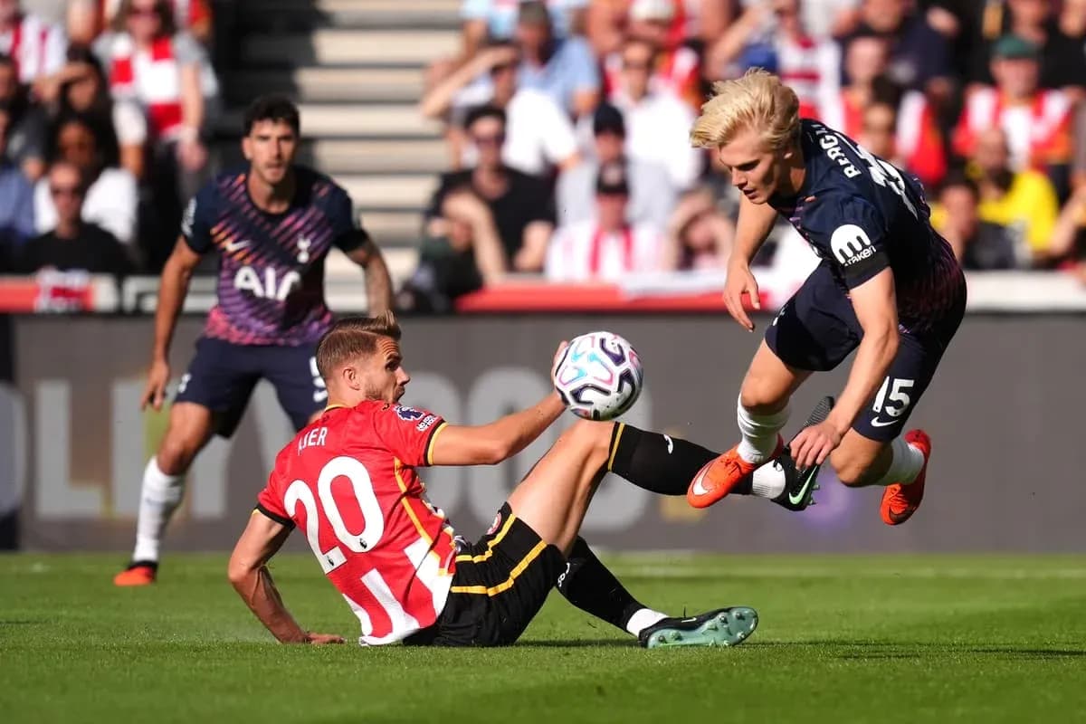 Player sliding to tackle during football match Player sliding to tackle during football match