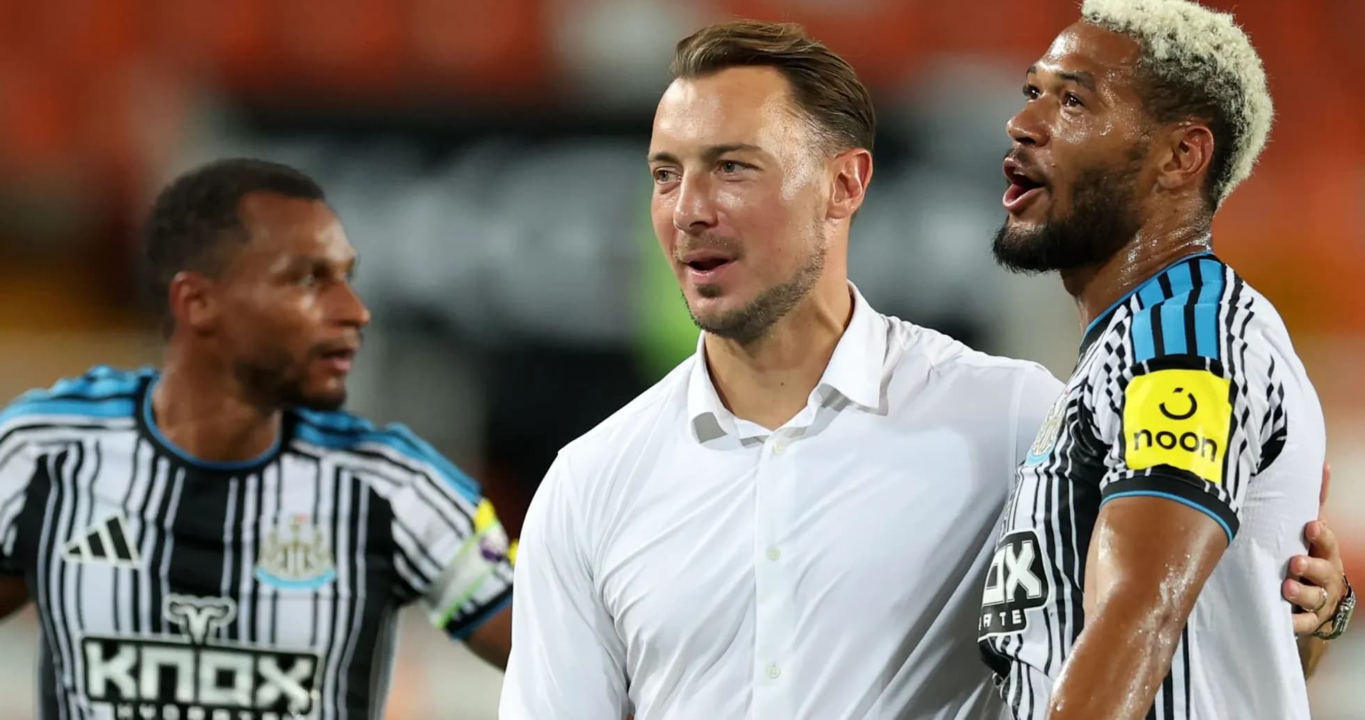 Three Newcastle United players celebrating together Three Newcastle United players celebrating together