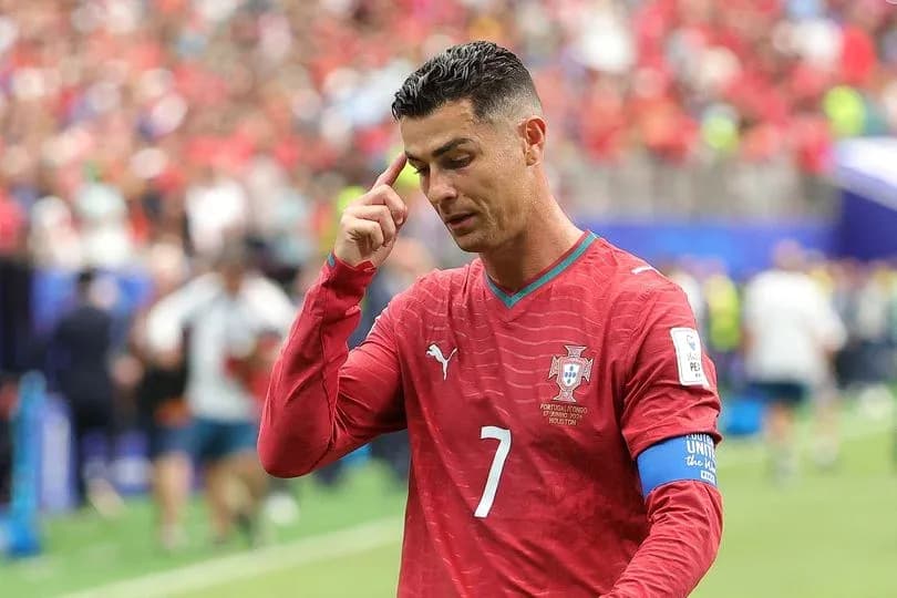 Cristiano Ronaldo touching his forehead during match Cristiano Ronaldo touching his forehead during match