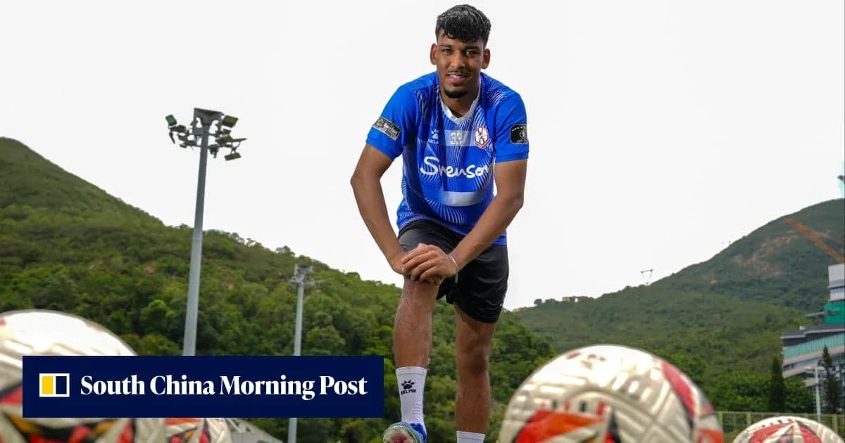 Player posing on training field with footballs Player posing on training field with footballs