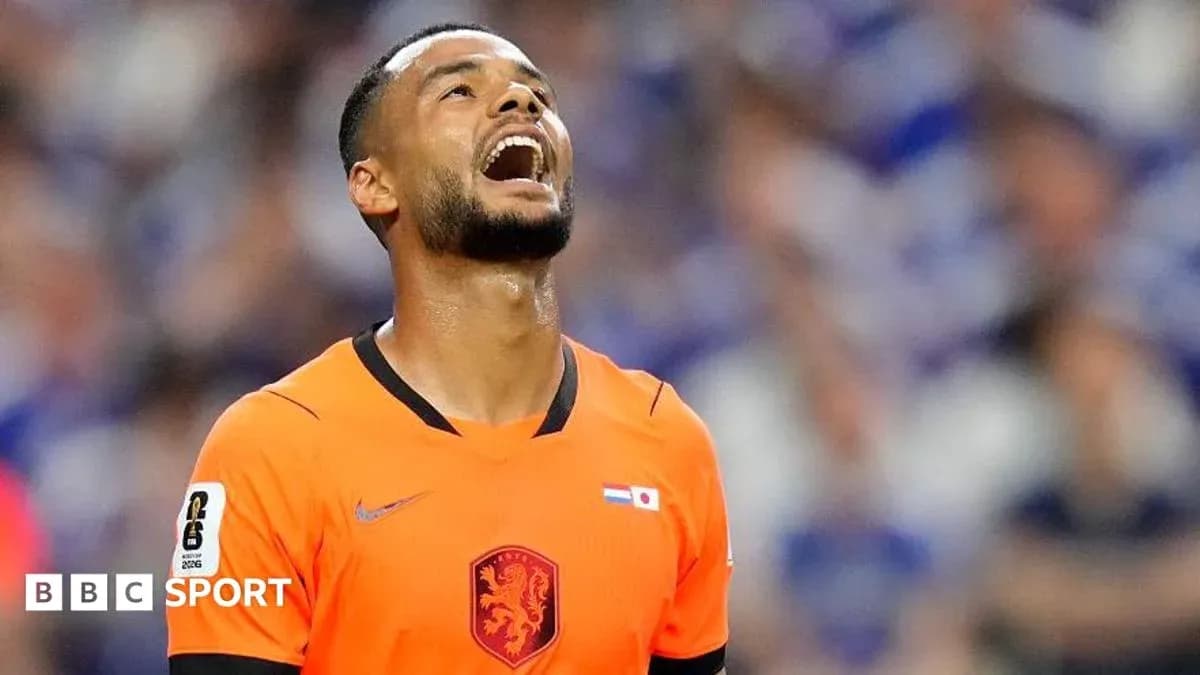 Goalkeeper in orange kit reacting during match Goalkeeper in orange kit reacting during match