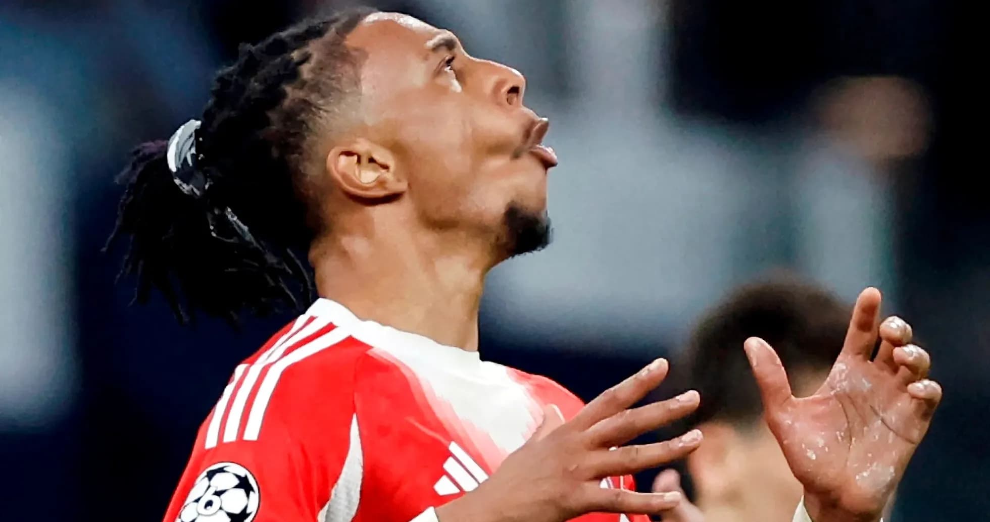 Player celebrating with hands raised during match Player celebrating with hands raised during match