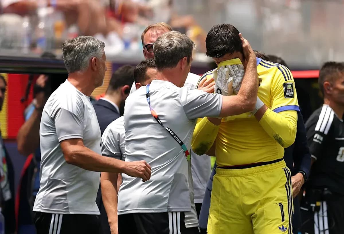 Goalkeeper receiving support from coaches on sidelines Goalkeeper receiving support from coaches on sidelines