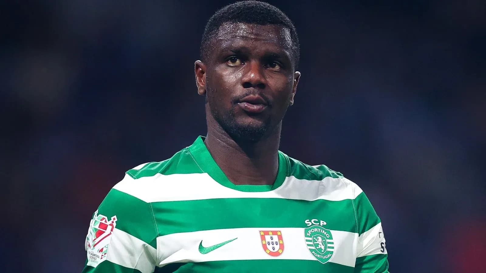 Player wearing green and white striped jersey Player wearing green and white striped jersey