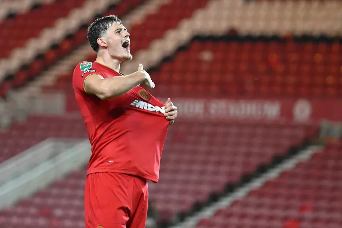Player celebrating and lifting shirt after scoring Player celebrating and lifting shirt after scoring