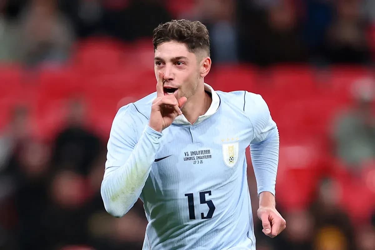Player celebrating with finger on lips during match Player celebrating with finger on lips during match