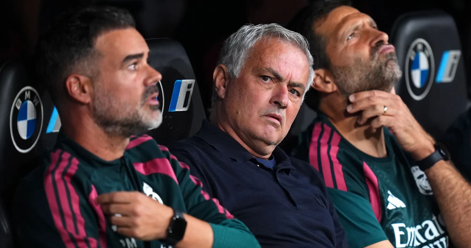 Coaches seated on bench during a match Coaches seated on bench during a match