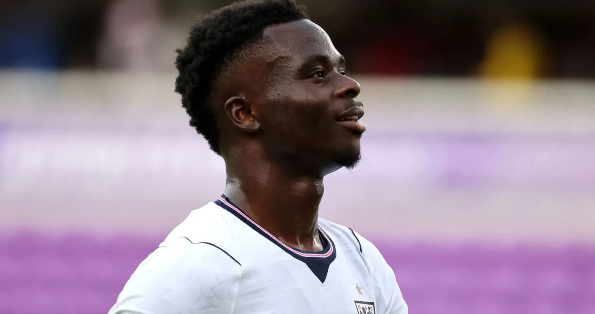 Player in England kit smiling during match Player in England kit smiling during match