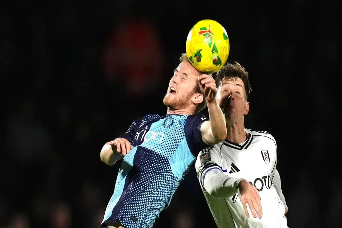 Two players contesting a high ball during match Two players contesting a high ball during match