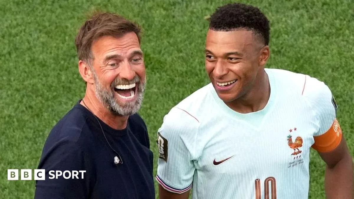 Coach and player smiling on the field after match Coach and player smiling on the field after match