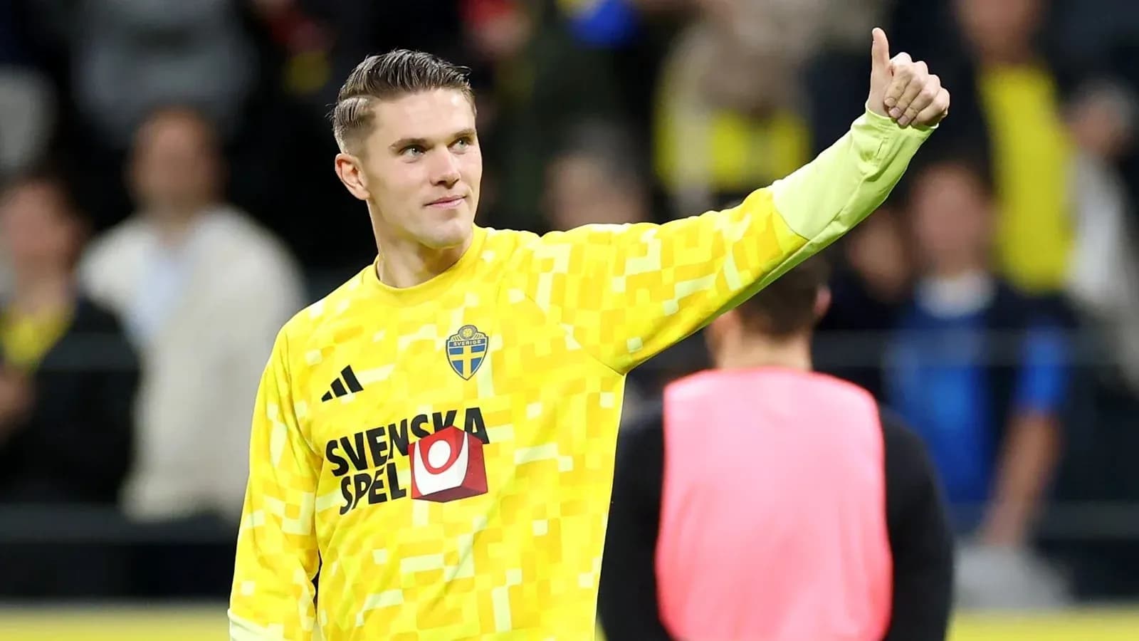 Goalkeeper in yellow kit giving thumbs up Goalkeeper in yellow kit giving thumbs up
