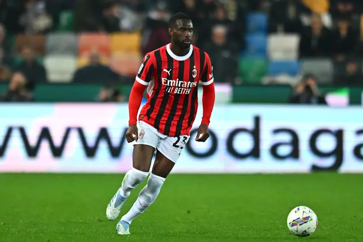 AC Milan player dribbling the ball on field AC Milan player dribbling the ball on field