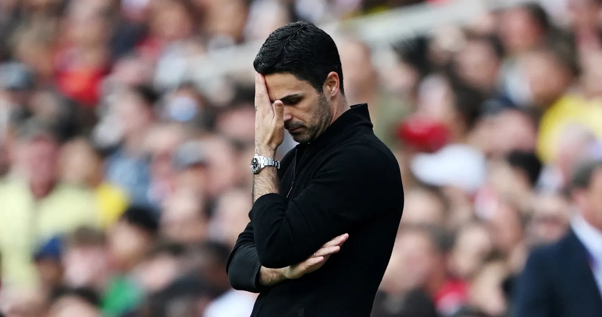 Manager with hand on face during match Manager with hand on face during match