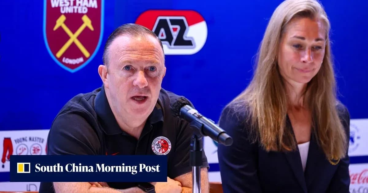 Man speaking at press conference with woman beside Man speaking at press conference with woman beside