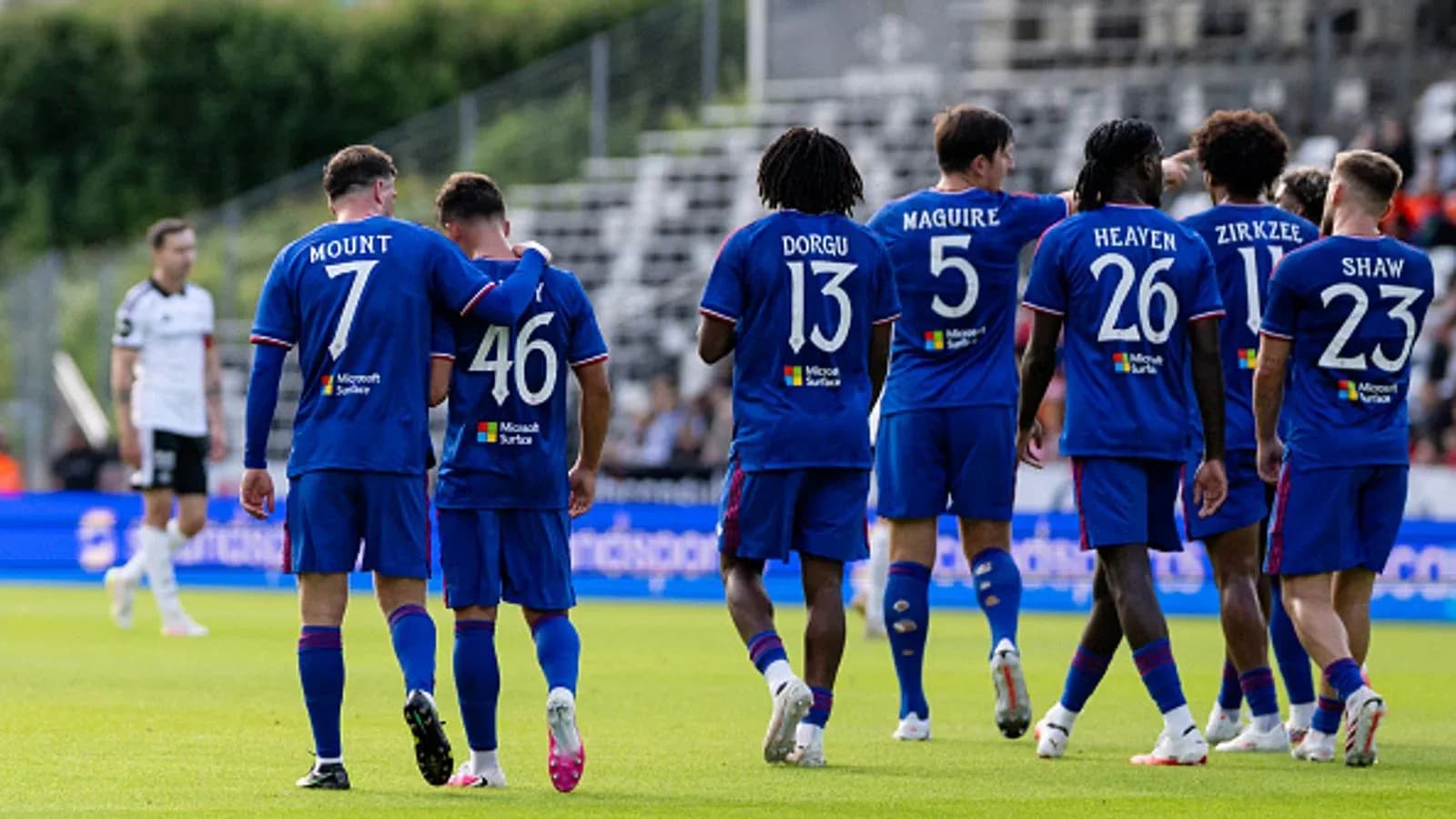 Team celebrating with player after scoring goal Team celebrating with player after scoring goal