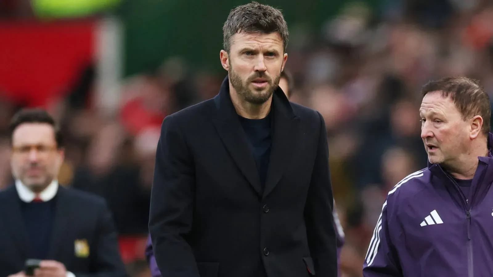 Coaches walking on the sidelines during a match Coaches walking on the sidelines during a match