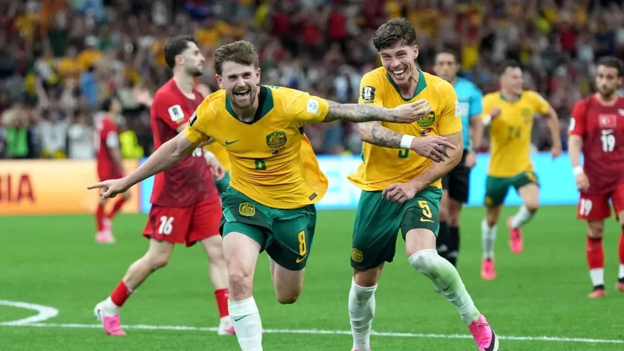 Australian players celebrating a goal in match Australian players celebrating a goal in match