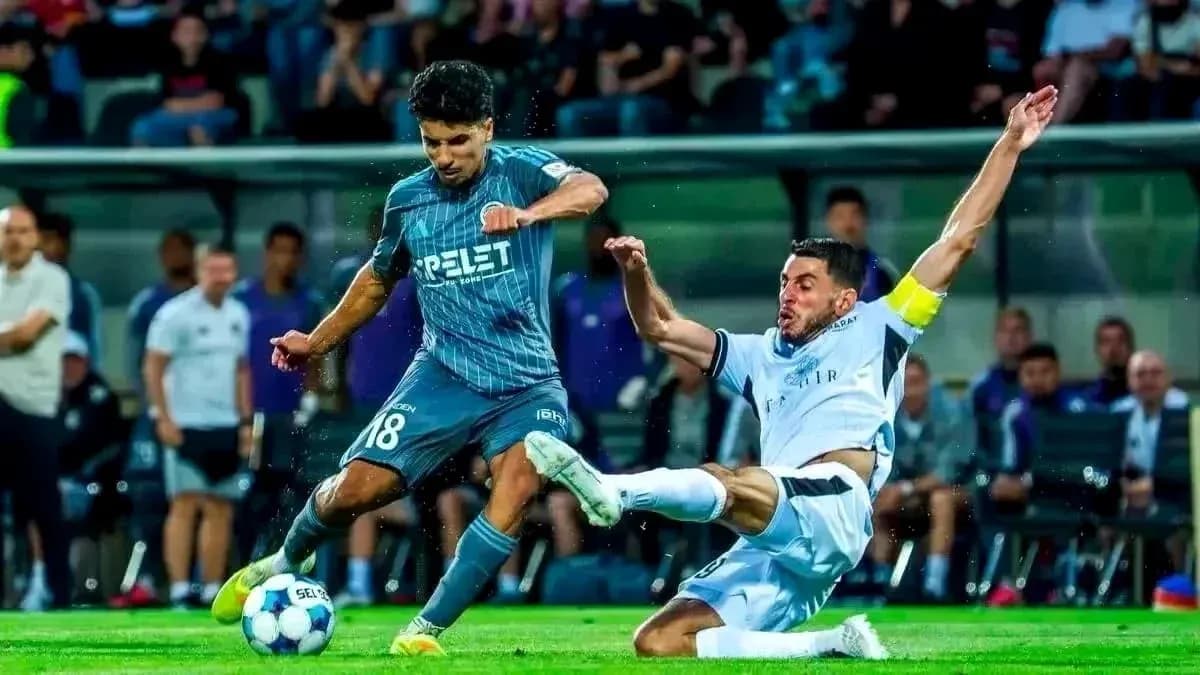 Player tackling during Hapoel Beer Sheva match Player tackling during Hapoel Beer Sheva match