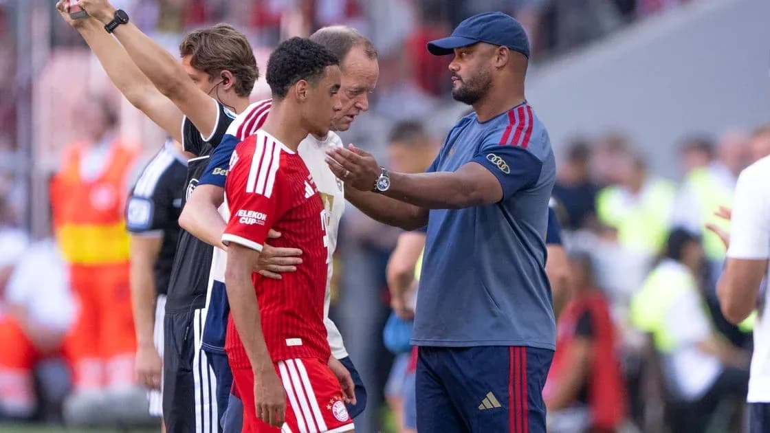 Coach interacting with player during match substitution Coach interacting with player during match substitution