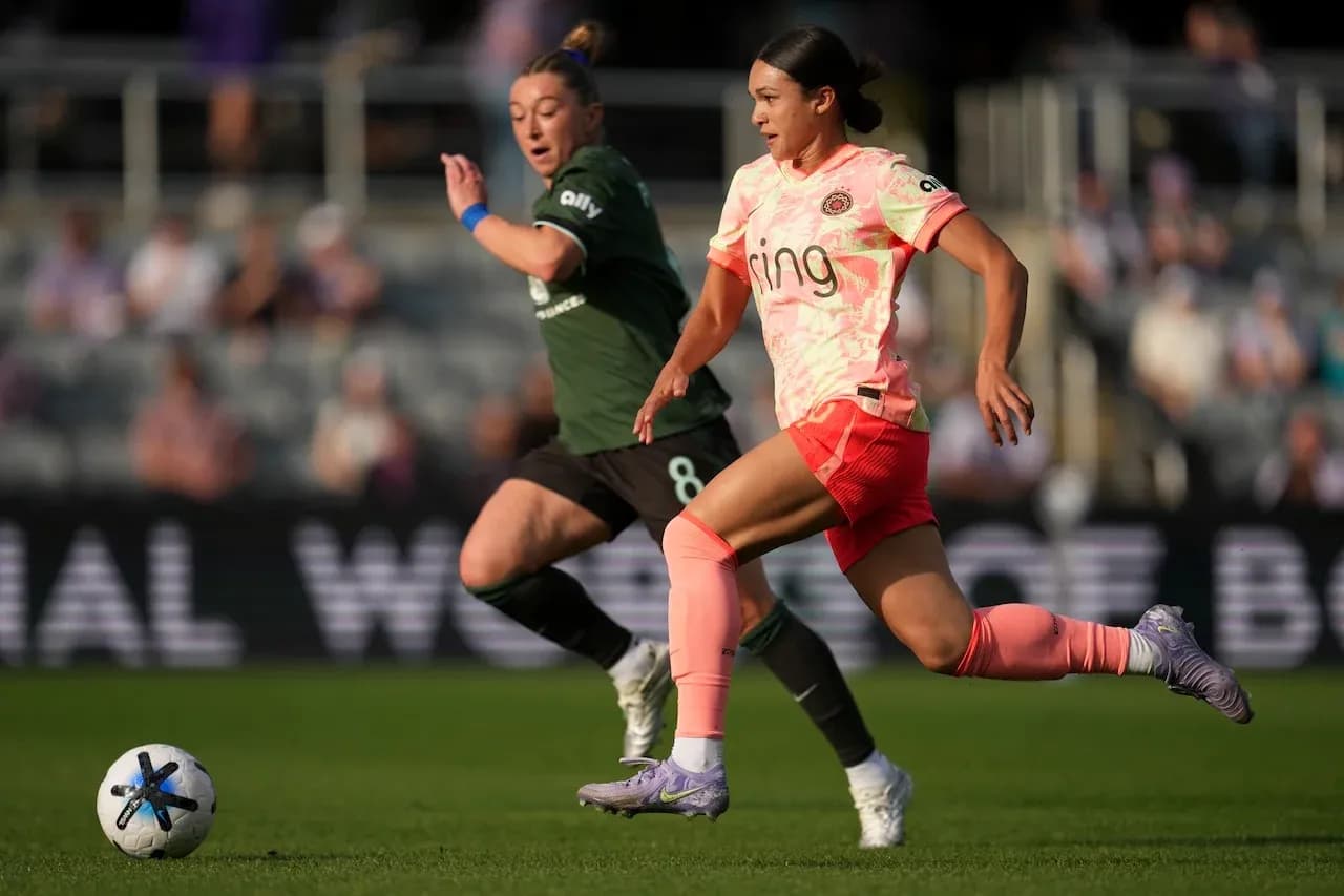 Player sprinting with ball during NWSL match Player sprinting with ball during NWSL match