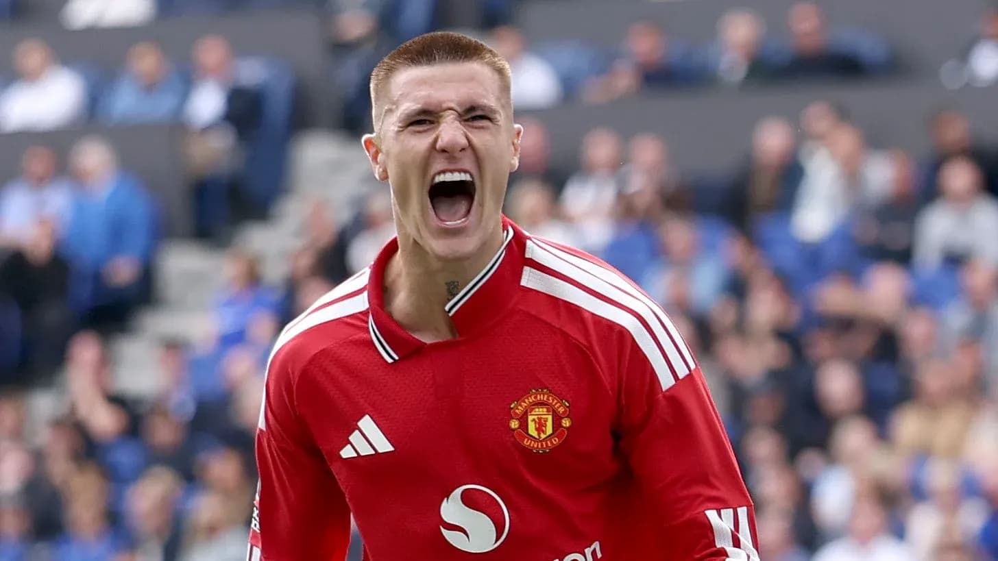 Goalkeeper celebrating a save in Manchester United jersey Goalkeeper celebrating a save in Manchester United jersey