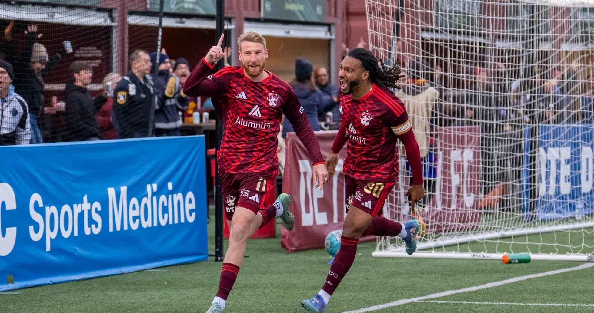 Players celebrating a goal during Detroit City match Players celebrating a goal during Detroit City match