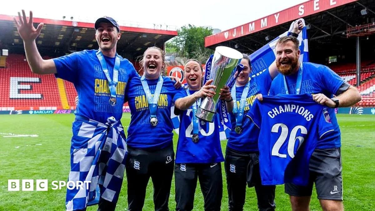 Celebrating team with trophy and championship shirts Celebrating team with trophy and championship shirts