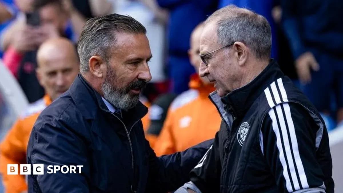 Two football managers shaking hands before match Two football managers shaking hands before match