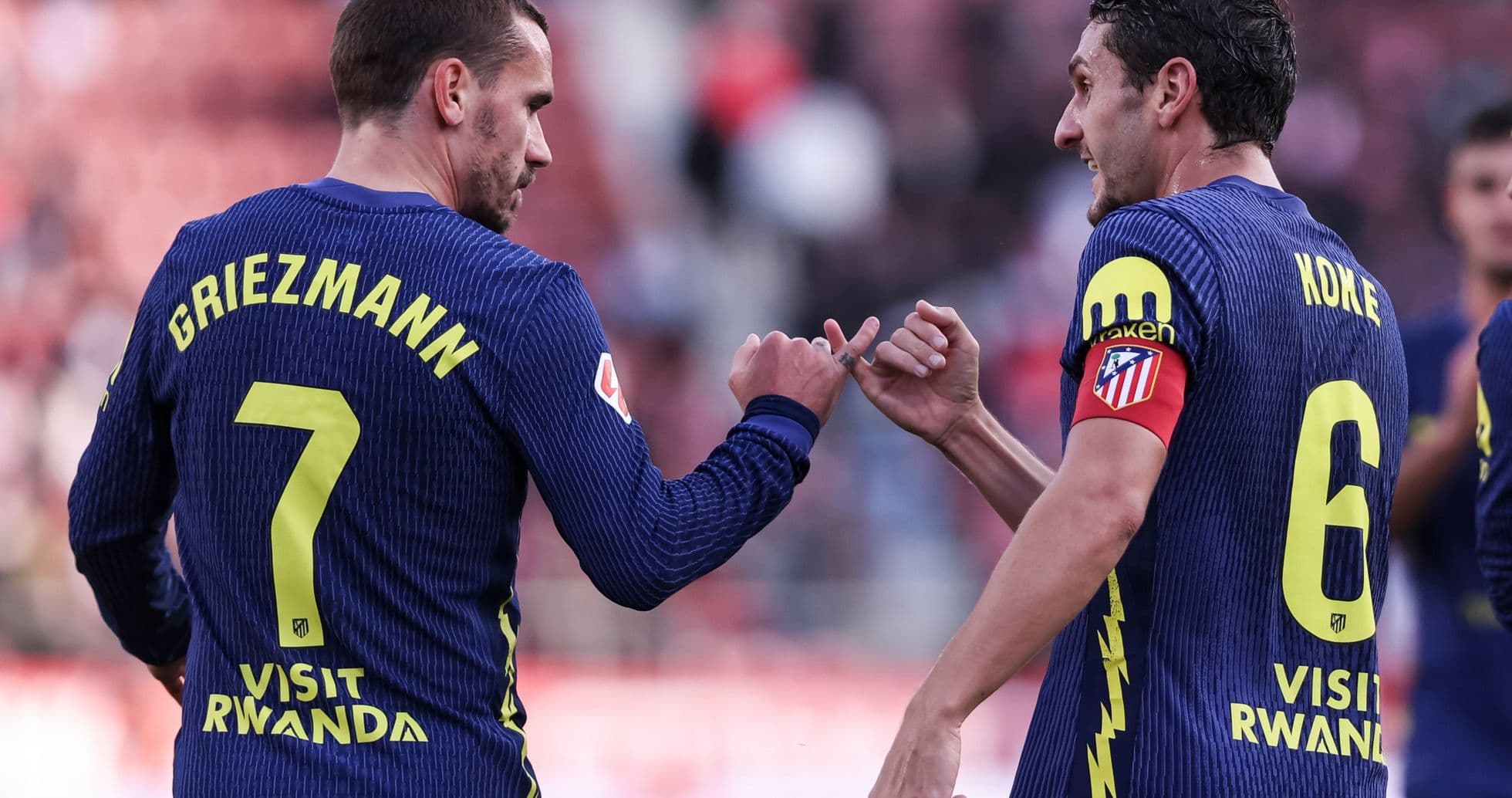 Griezmann and Koke celebrating during match Griezmann and Koke celebrating during match