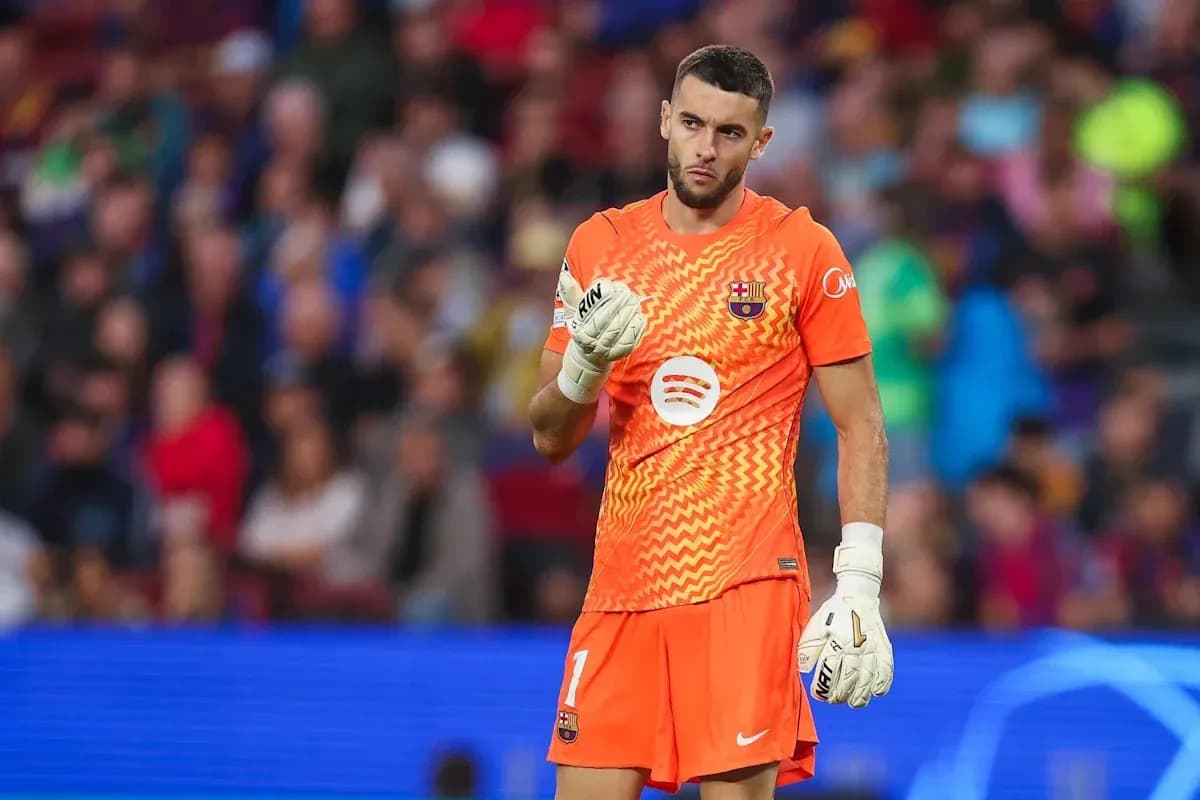 Goalkeeper in orange kit during a match Goalkeeper in orange kit during a match