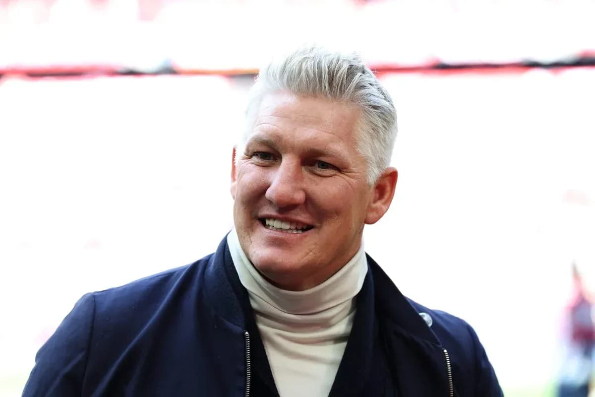 Former player smiling in stadium setting Former player smiling in stadium setting