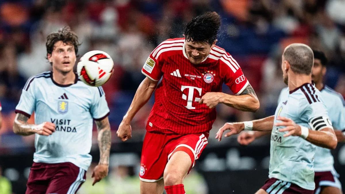 Player heading the ball during a football match Player heading the ball during a football match