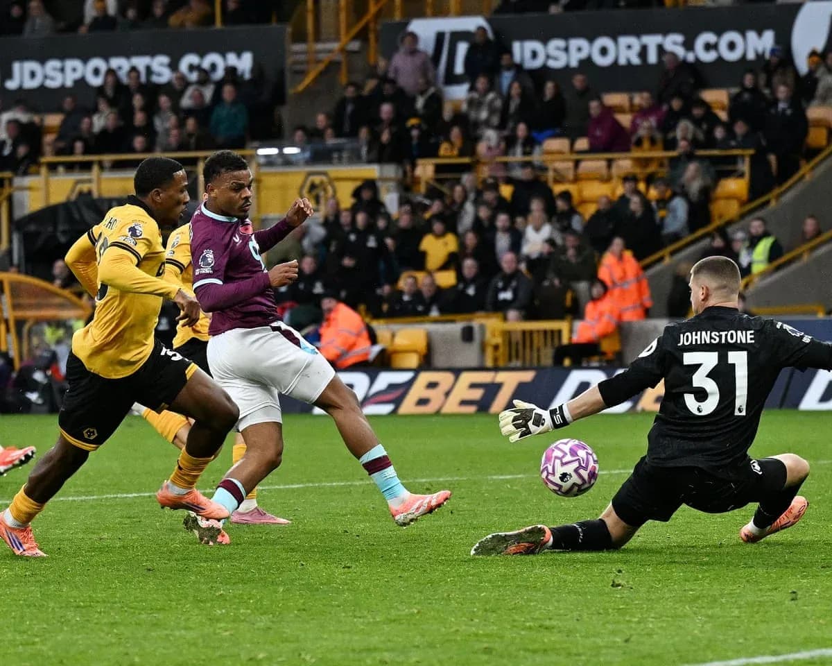 Player attempting to score against Wolves goalkeeper Player attempting to score against Wolves goalkeeper