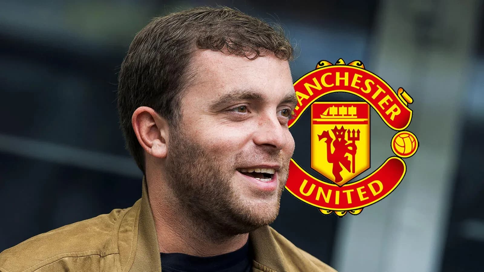 Man smiling with Manchester United logo in background Man smiling with Manchester United logo in background