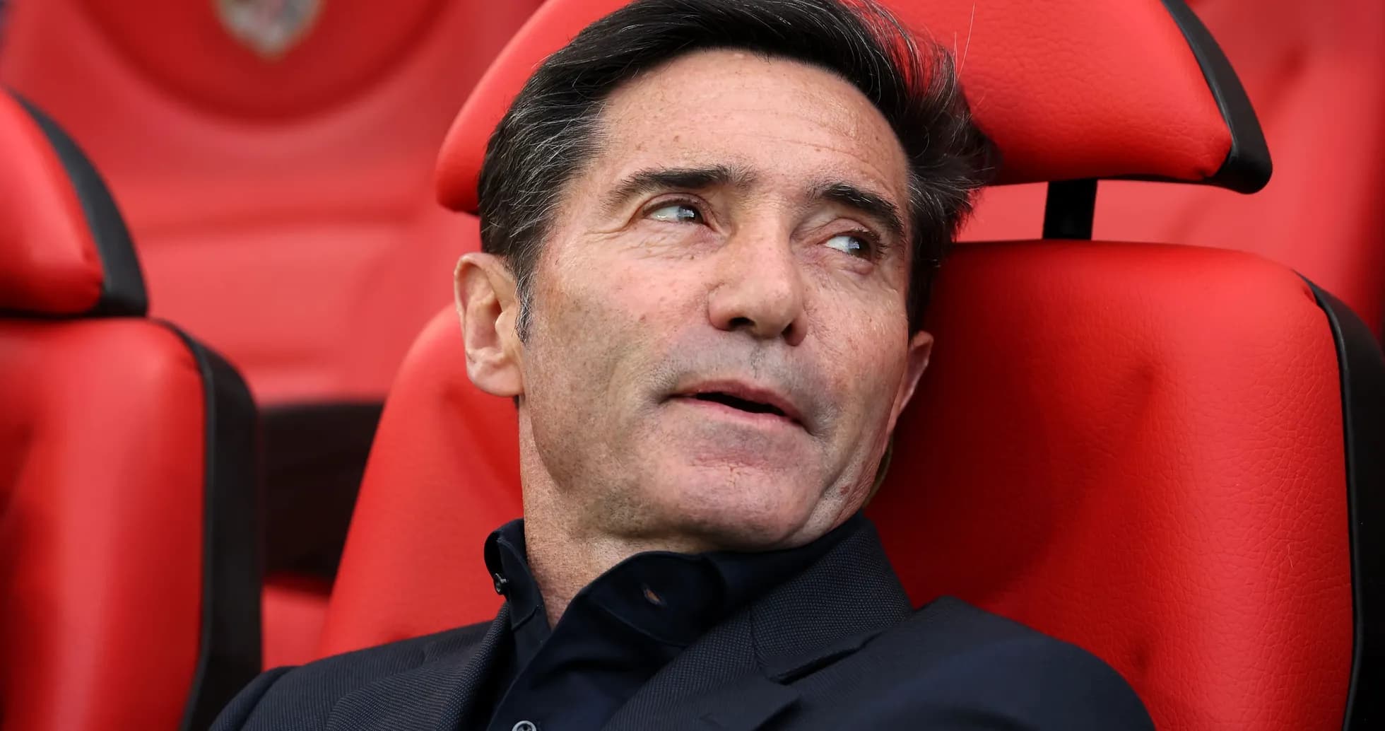 Coach sitting on bench during match Coach sitting on bench during match