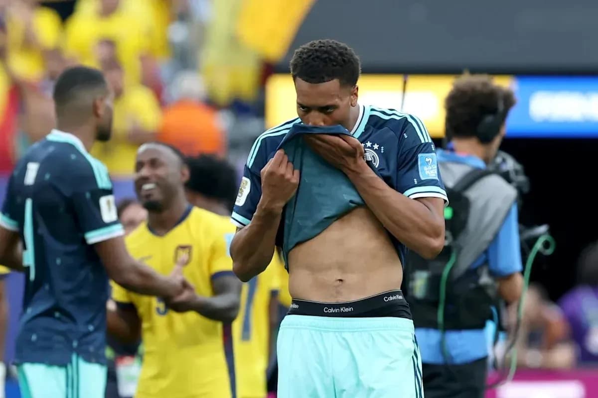 Player removing shirt after match in stadium Player removing shirt after match in stadium