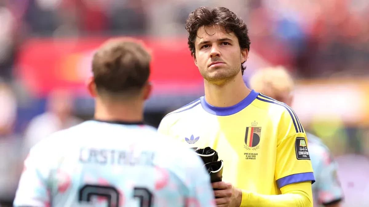 Goalkeeper in yellow kit looking towards teammate Goalkeeper in yellow kit looking towards teammate