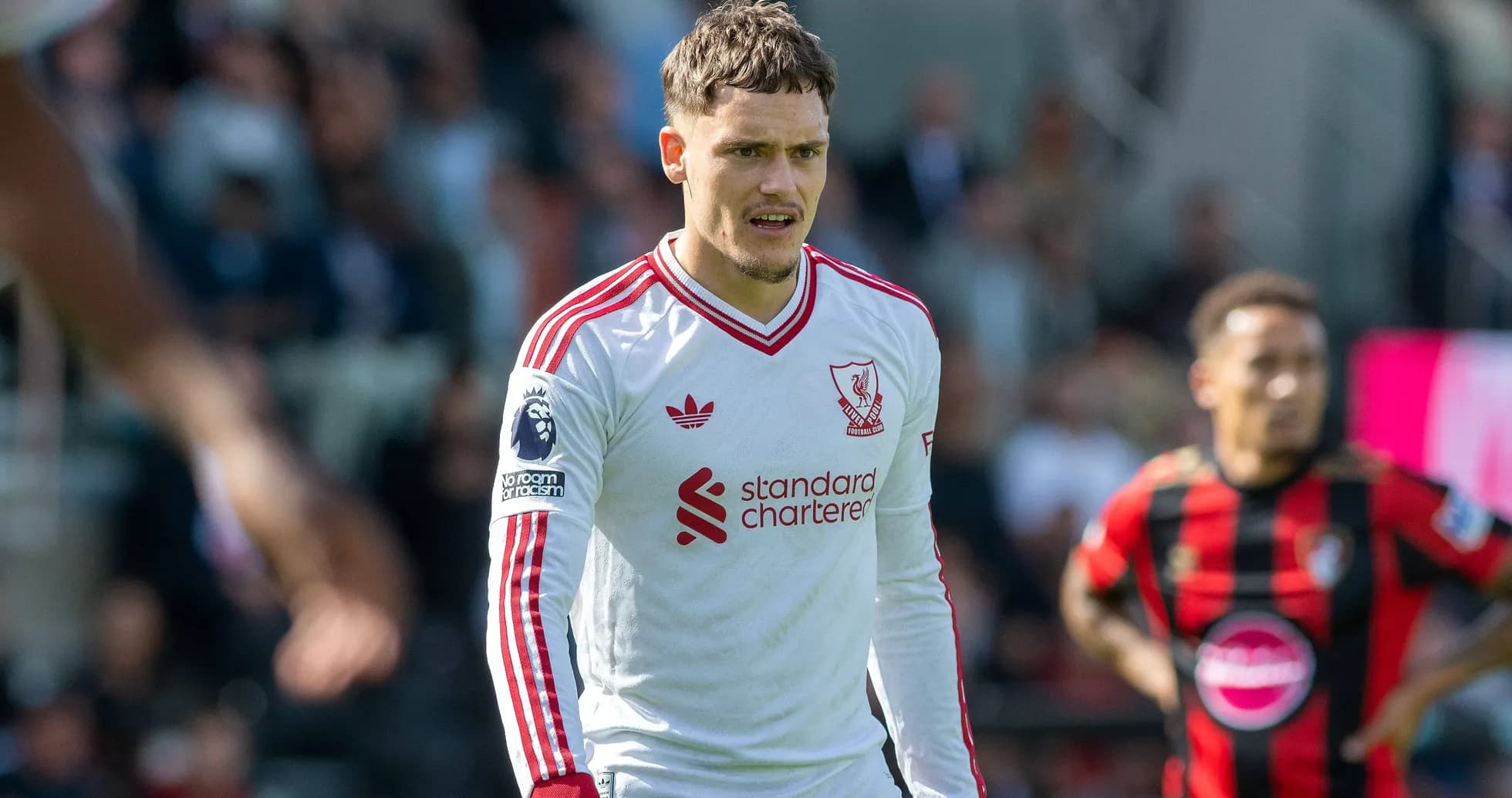 Liverpool player wearing white kit during match Liverpool player wearing white kit during match