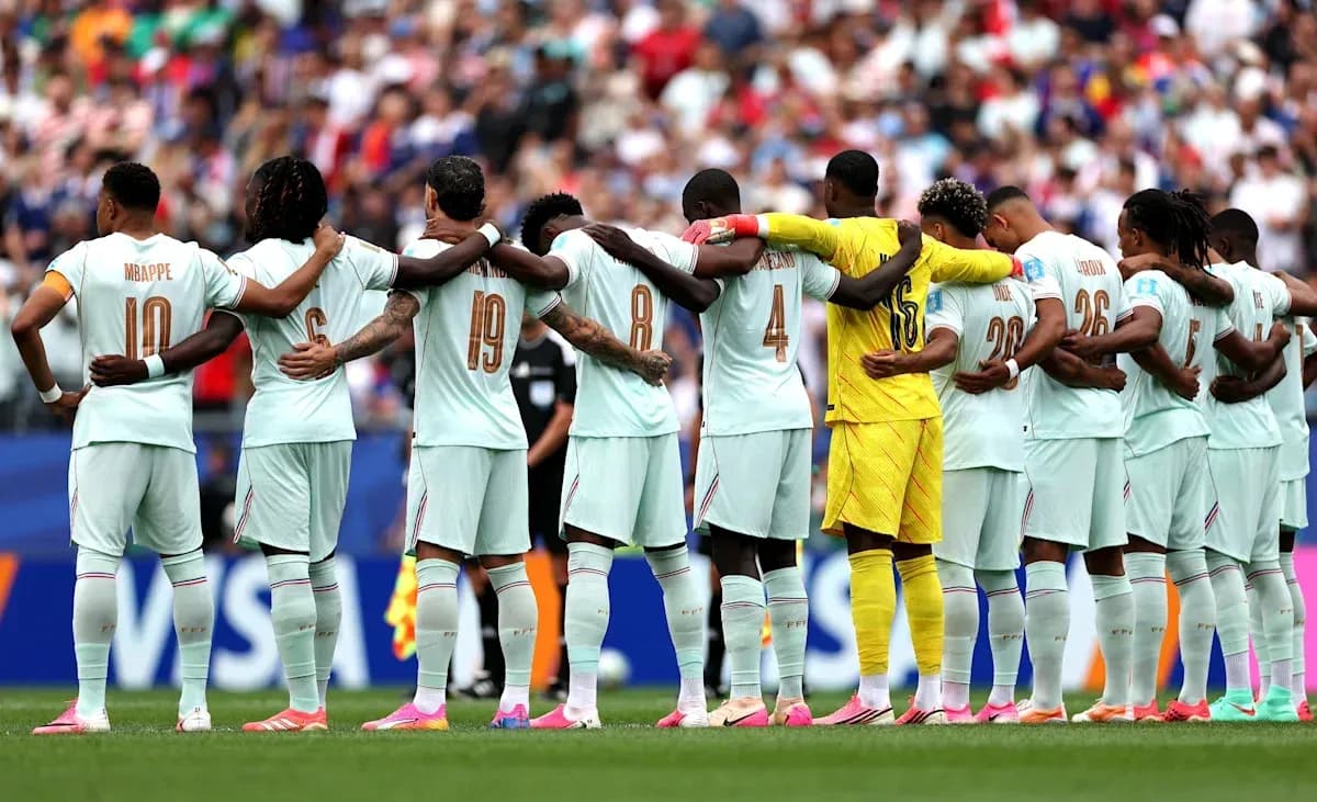Team standing in solidarity before the match Team standing in solidarity before the match