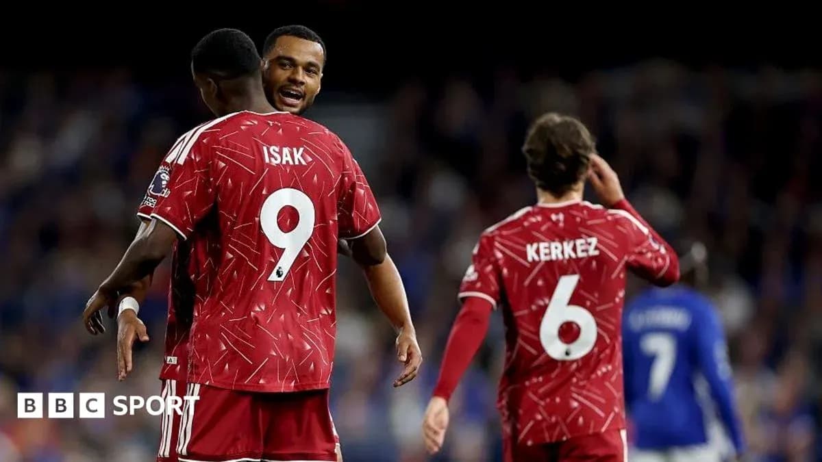 Players celebrating in red jerseys during match Players celebrating in red jerseys during match
