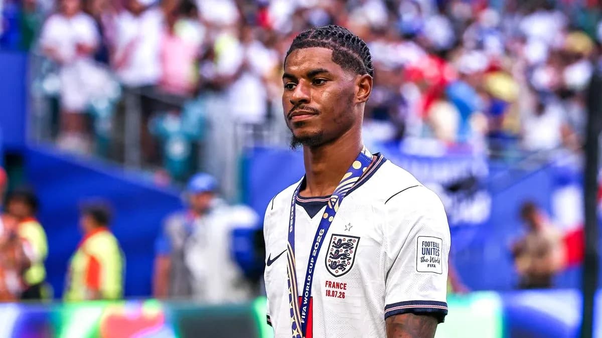 Player wearing England jersey with medal on field Player wearing England jersey with medal on field