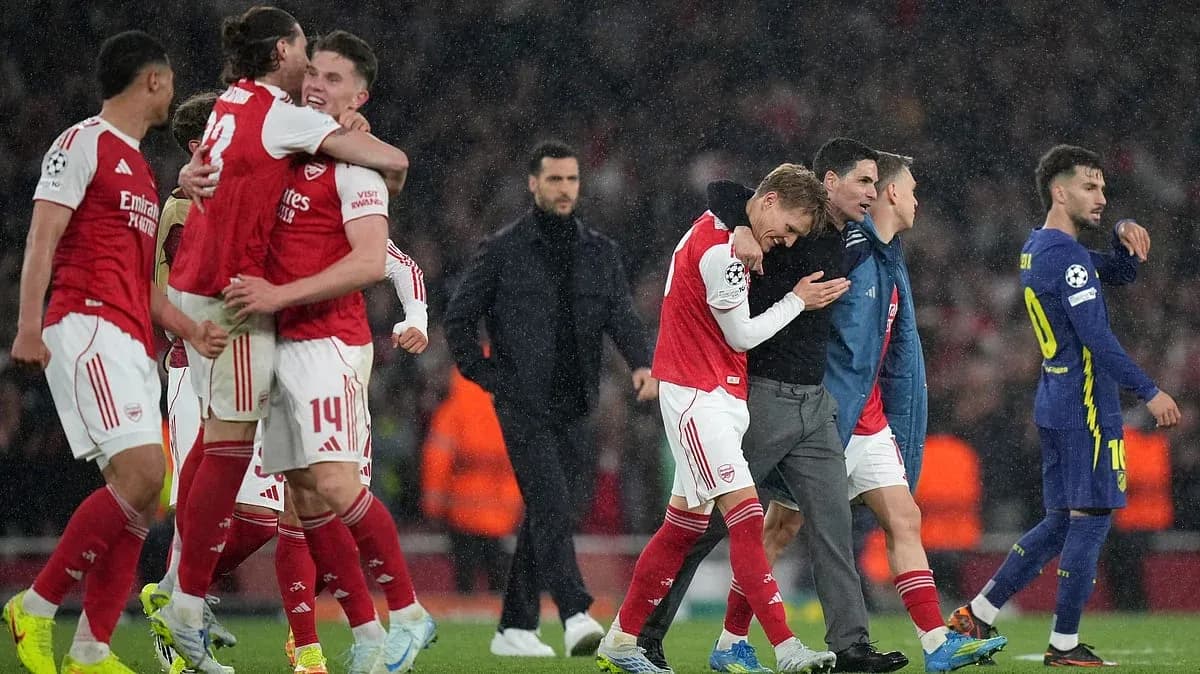 Arsenal players celebrating victory against Atletico Madrid Arsenal players celebrating victory against Atletico Madrid