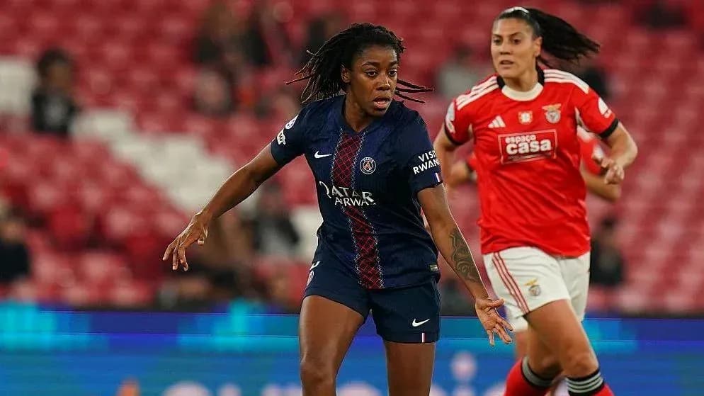 PSG player dribbling past Benfica defender during match PSG player dribbling past Benfica defender during match
