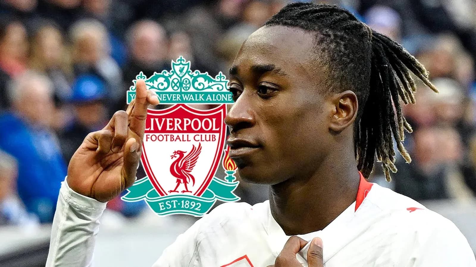 Player gesturing with Liverpool logo in background Player gesturing with Liverpool logo in background