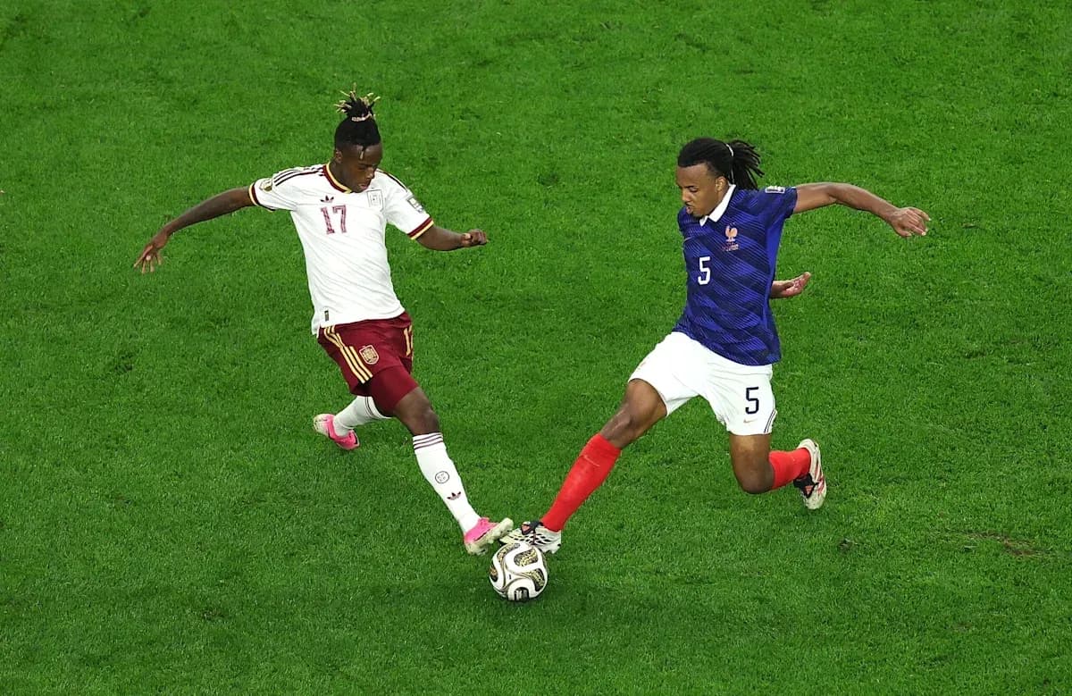 Two players competing for the ball during match Two players competing for the ball during match