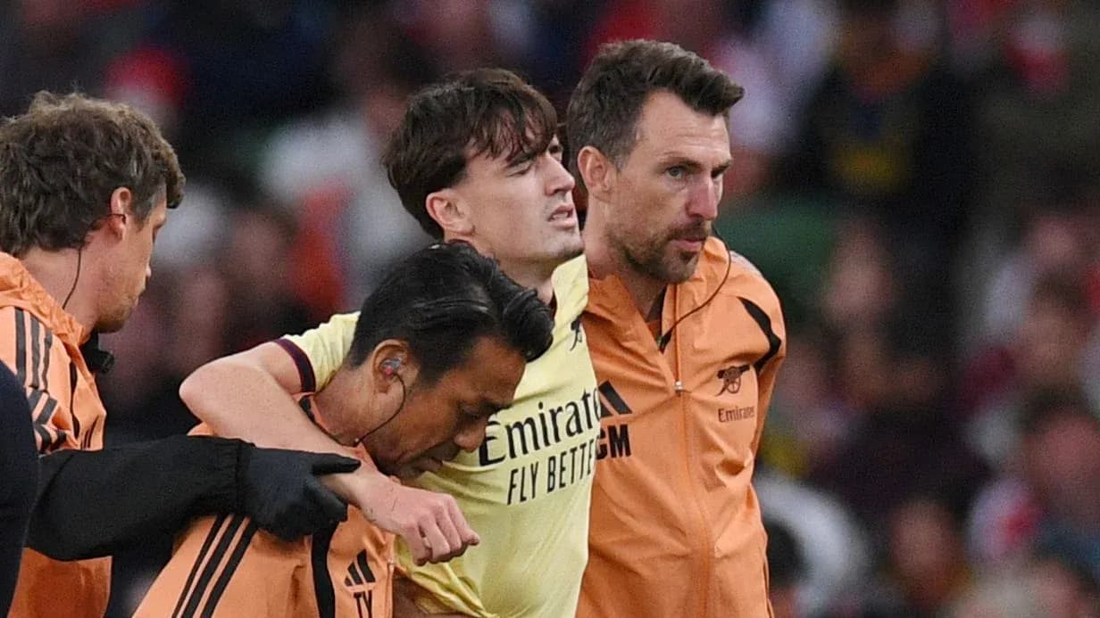 Player being assisted off the field by staff Player being assisted off the field by staff
