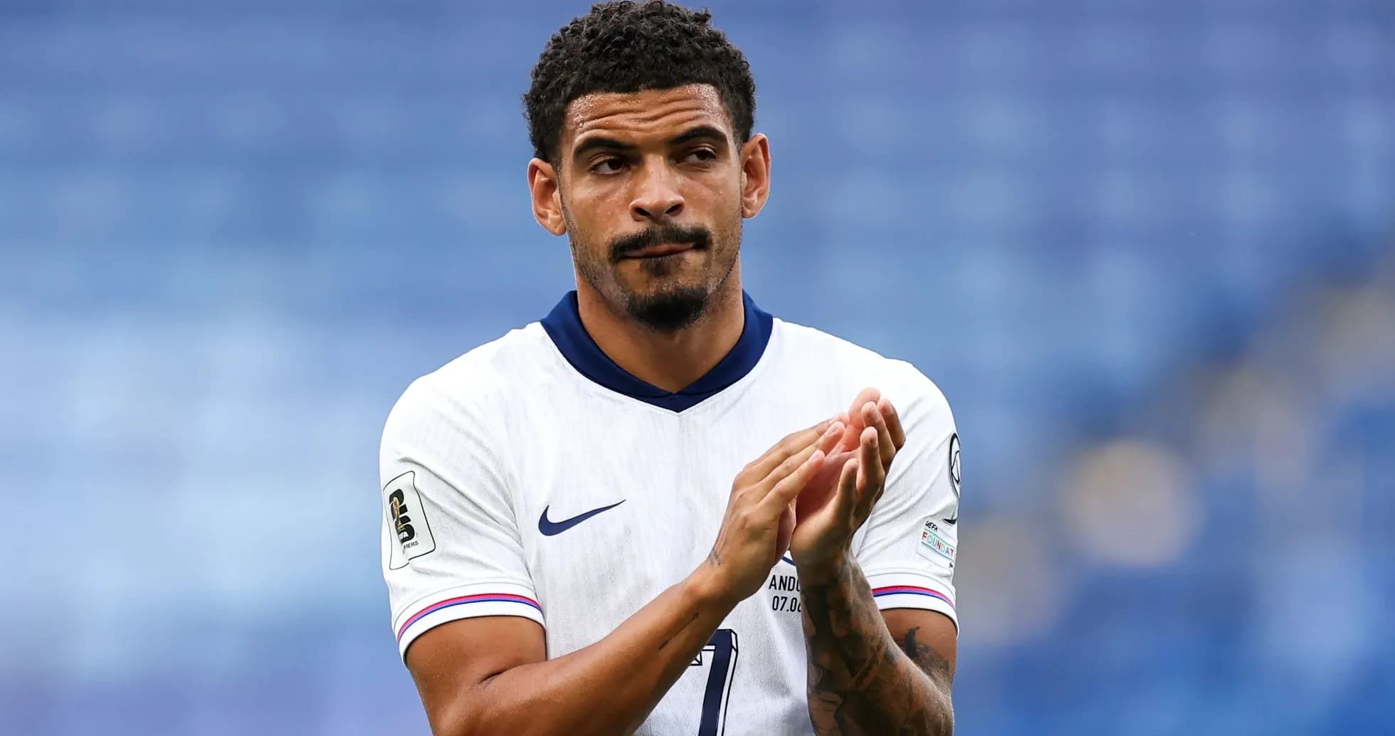 Player applauding after a match in white jersey Player applauding after a match in white jersey