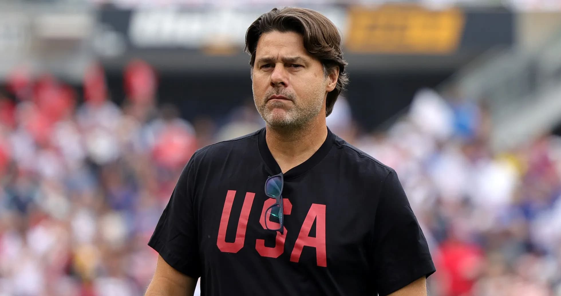 Coach wearing USA shirt on the sidelines Coach wearing USA shirt on the sidelines