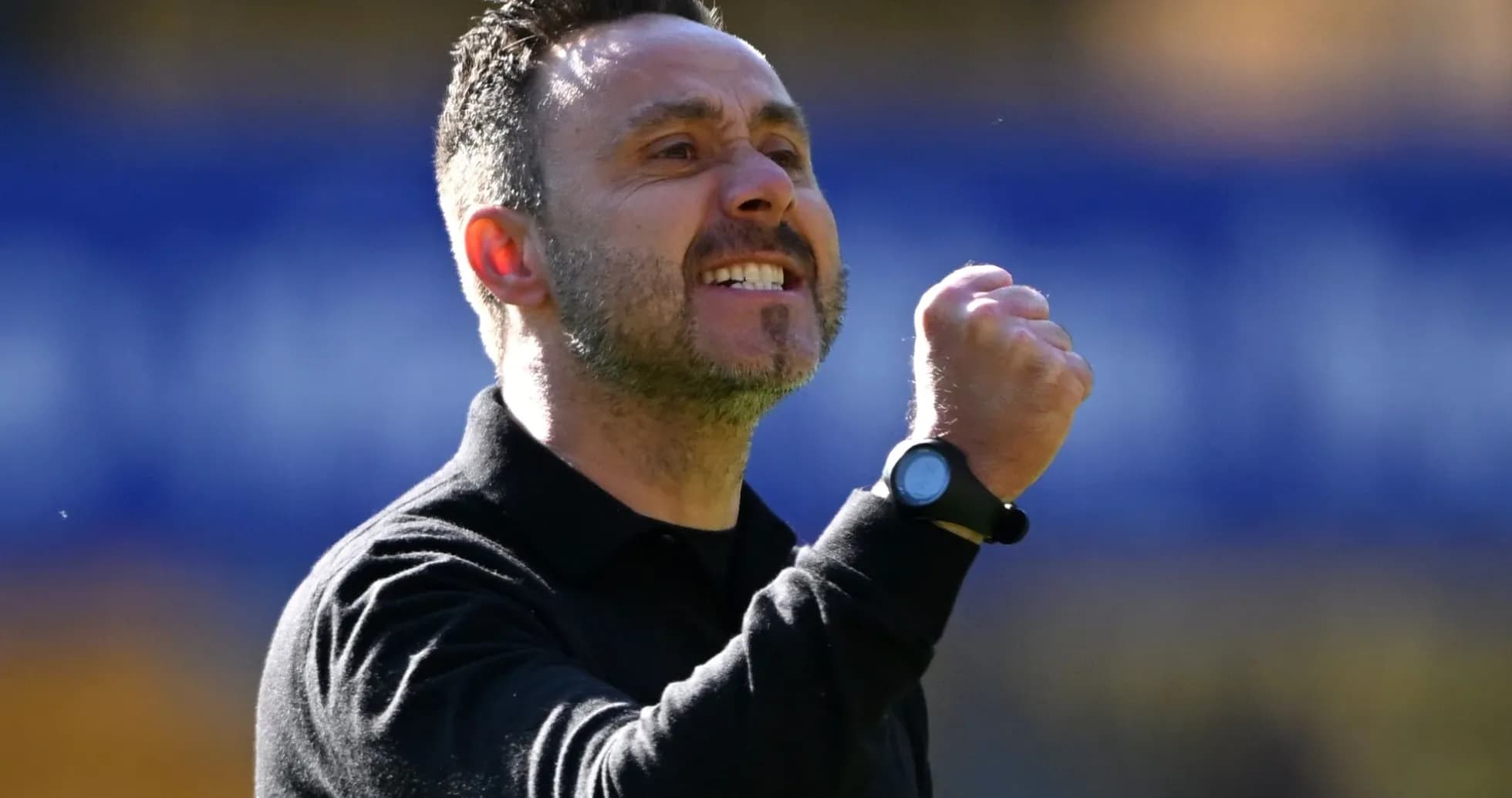 Coach celebrating with a clenched fist during match Coach celebrating with a clenched fist during match