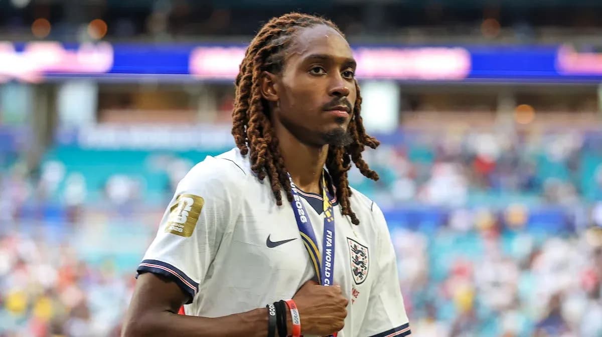 Player wearing England jersey with medal on neck Player wearing England jersey with medal on neck